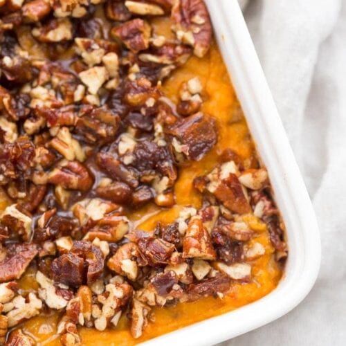 This Whole30 sweet potato casserole with pecans is a must for any Whole30 Thanksgiving table! With no sweeteners and a cinnamon pecan-date topping, you might end up eating the leftovers for breakfast (we did!). This Whole30 sweet potato casserole is naturally sweetened and just so delicious. A new Whole30 Thanksgiving classic! 