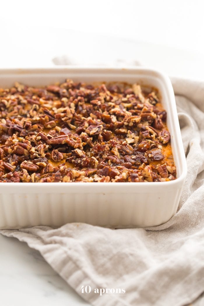 This Whole30 sweet potato casserole with pecans is a must for any Whole30 Thanksgiving table! With no sweeteners and a cinnamon pecan-date topping, you might end up eating the leftovers for breakfast (we did!). This Whole30 sweet potato casserole is naturally sweetened and just so delicious. A new Whole30 Thanksgiving classic! 