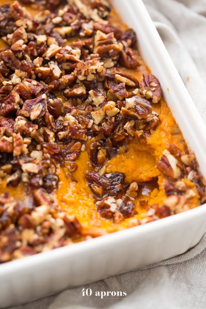 This Whole30 sweet potato casserole with pecans is a must for any Whole30 Thanksgiving table! With no sweeteners and a cinnamon pecan-date topping, you might end up eating the leftovers for breakfast (we did!). This Whole30 sweet potato casserole is naturally sweetened and just so delicious. A new Whole30 Thanksgiving classic! 