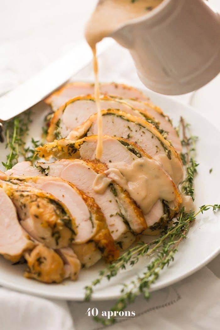 This Whole30 turkey breast and gravy is epic: brined to perfection with an herb butter stuffed under the skin (using ghee, of course)! It's my perfect Thanksgiving turkey made Whole30 Thanksgiving compliant, and it's a must for any paleo Thanksgiving or Whole30 Thanksgiving! This Whole30 turkey breast and gravy might actually become your favorite turkey recipe...