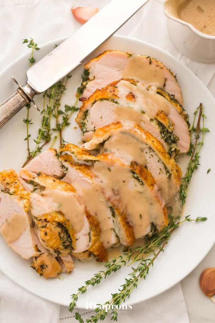 This Whole30 turkey breast and gravy is epic: brined to perfection with an herb butter stuffed under the skin (using ghee, of course)! It's my perfect Thanksgiving turkey made Whole30 Thanksgiving compliant, and it's a must for any paleo Thanksgiving or Whole30 Thanksgiving! This Whole30 turkey breast and gravy might actually become your favorite turkey recipe...