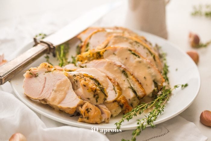 This Whole30 turkey breast and gravy is epic: brined to perfection with an herb butter stuffed under the skin (using ghee, of course)! It's my perfect Thanksgiving turkey made Whole30 Thanksgiving compliant, and it's a must for any paleo Thanksgiving or Whole30 Thanksgiving! This Whole30 turkey breast and gravy might actually become your favorite turkey recipe...