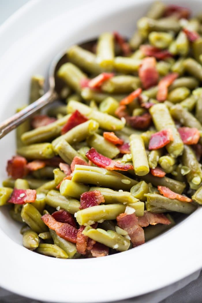 Whole30 Del Monte green beans with bacon in a white dish