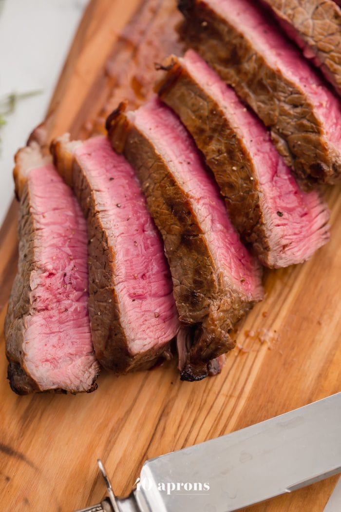 Medium-rare Whole30 steak with Whole30 béarnaise sauce in a dish