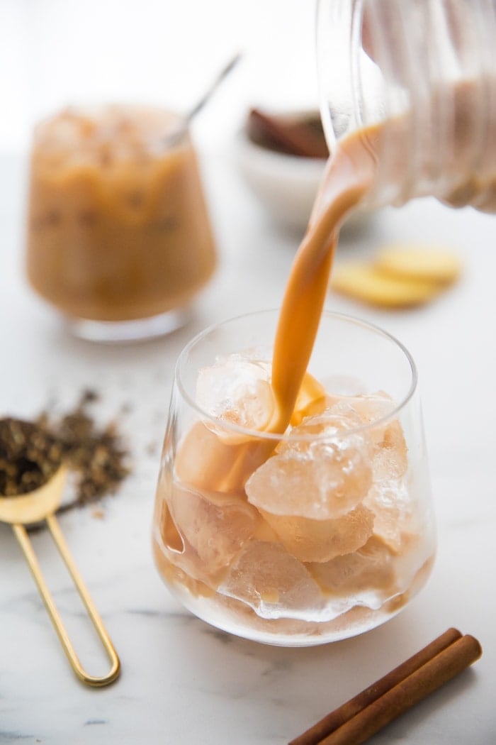 Vegan chai latte pouring