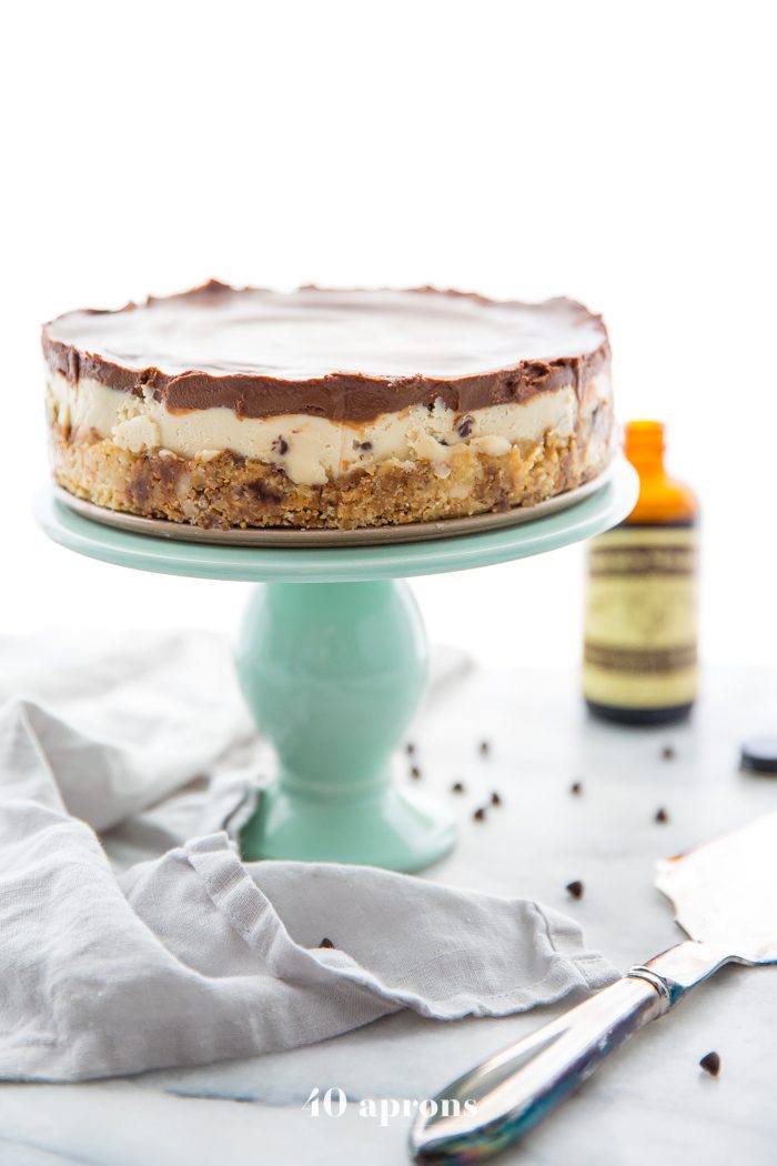 Whole vegan no bake cookie dough cheesecake on a cake stand