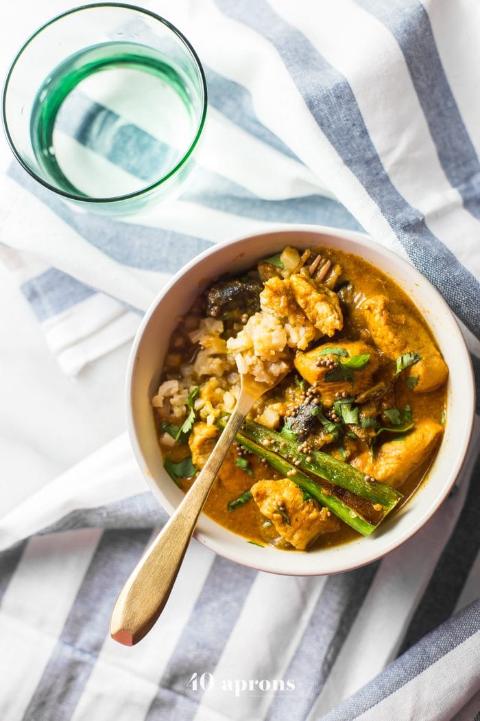 Whole30 chicken curry in a bowl with cauliflower rice