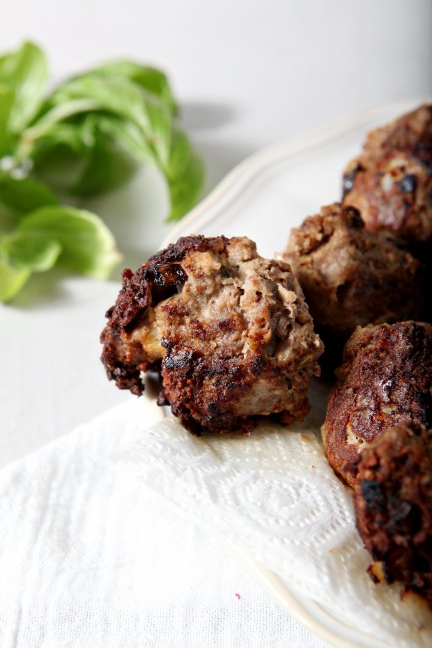 Close-up of Whole30 Meatballs on a plate lined with paper kitchen towels