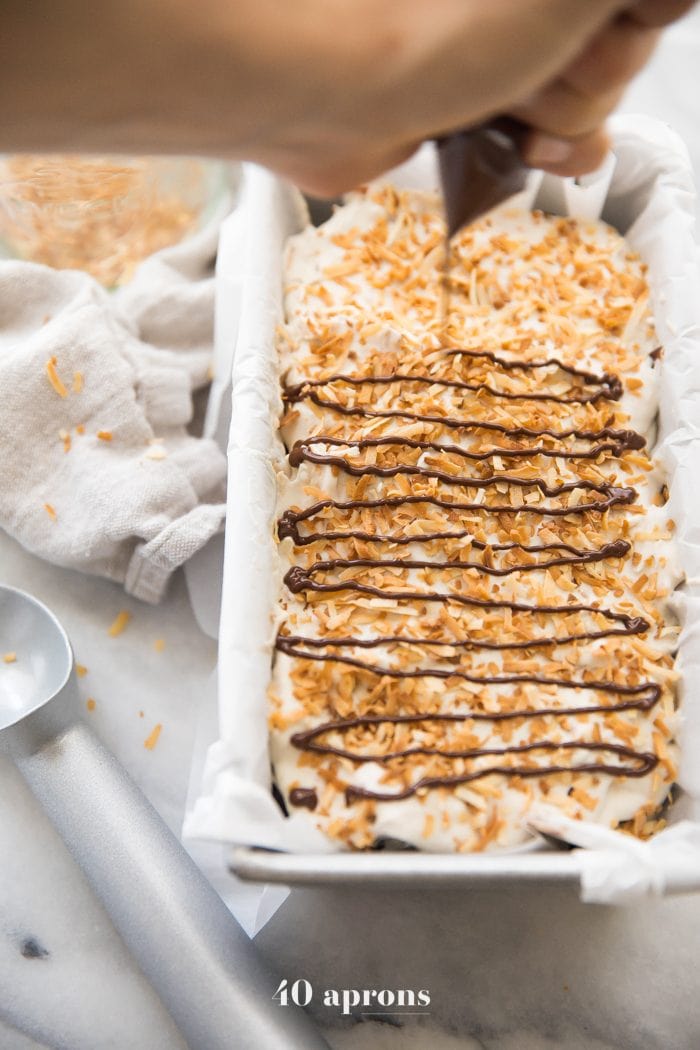 Drizzle chocolate over Samoas cookies ice cream and toasted coconut garnish