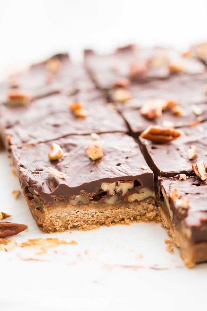 Batch of healthy paleo and vegan turtle bars on parchment paper