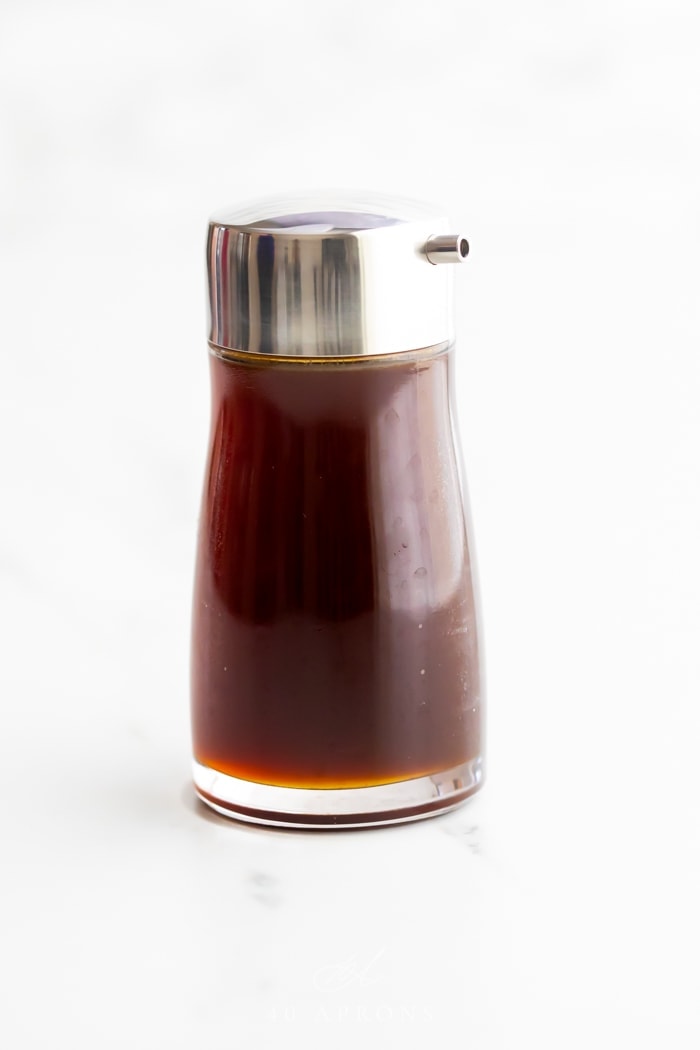 A bottle of healthy soy sauce substitute with a silver pour top