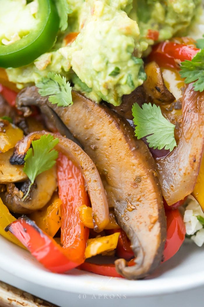 Up close of the sheet pan vegetarian fajitas, mushrooms, and peppers