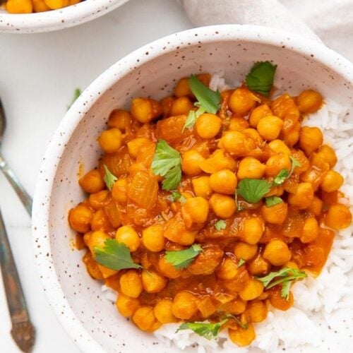 Up close bowl of chana masala over jasmine rice