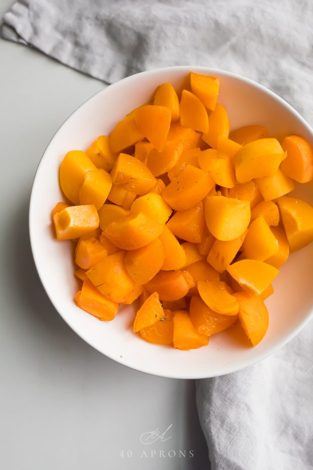 Diced apricots in a white bowl