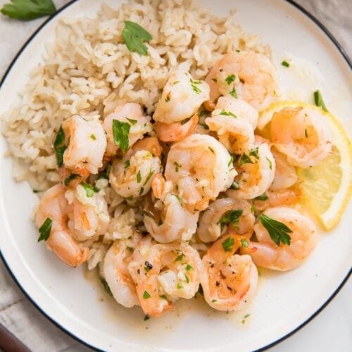 A plate of lemon garlic shrimp over rice