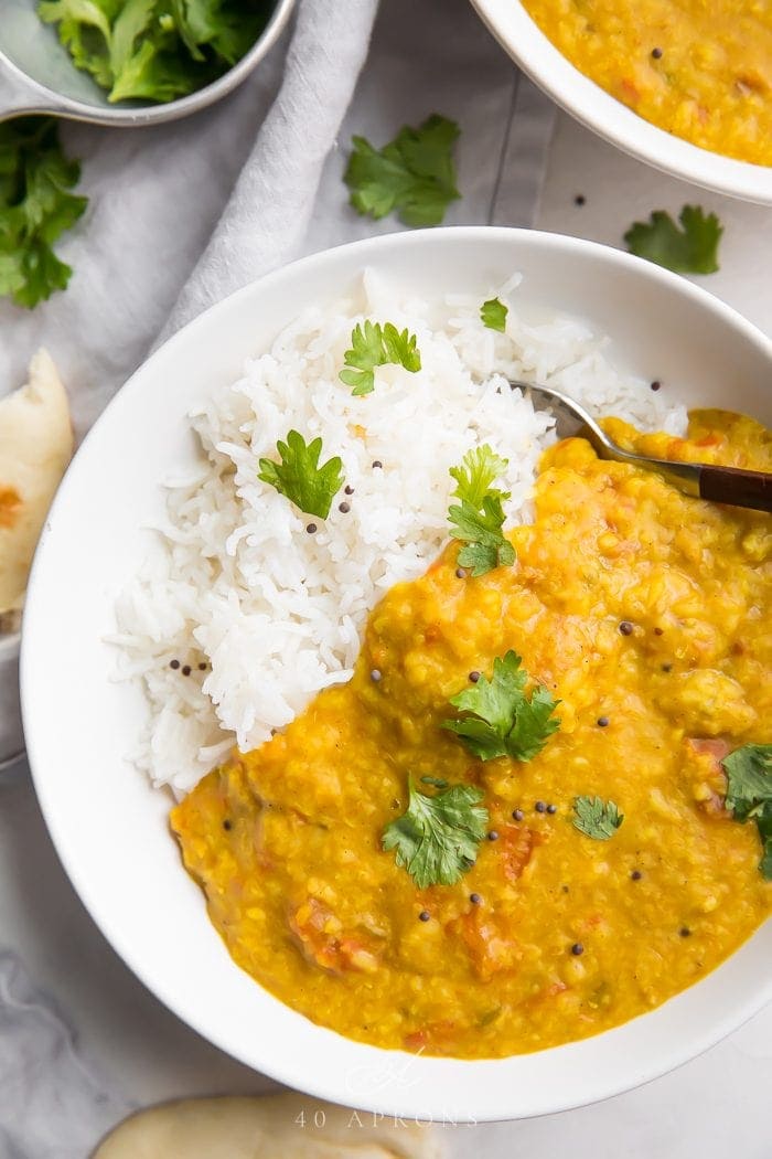 Instant Pot dal over basmati rice in a white bowl