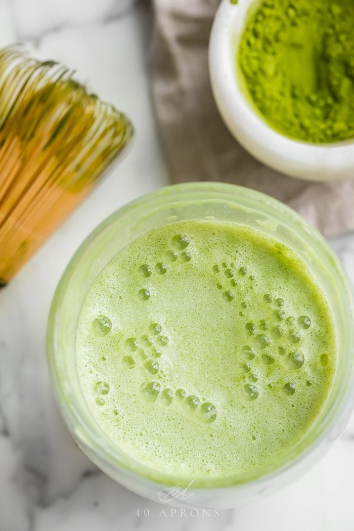 Top shot of a matcha latte in a glass