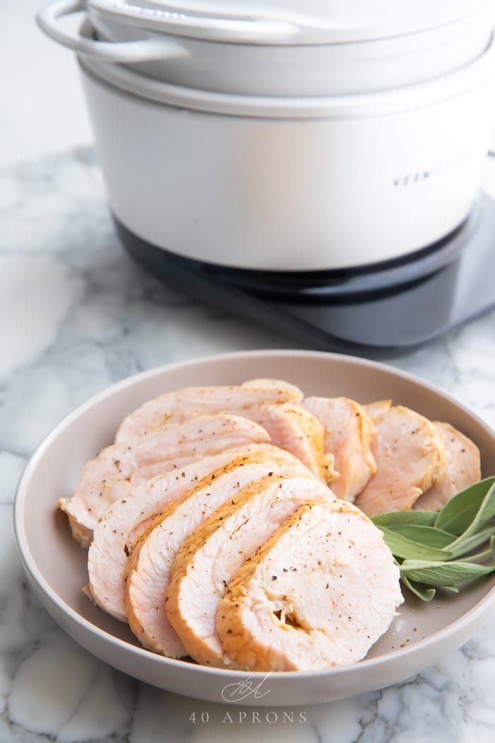 Slices of turkey on a white plate