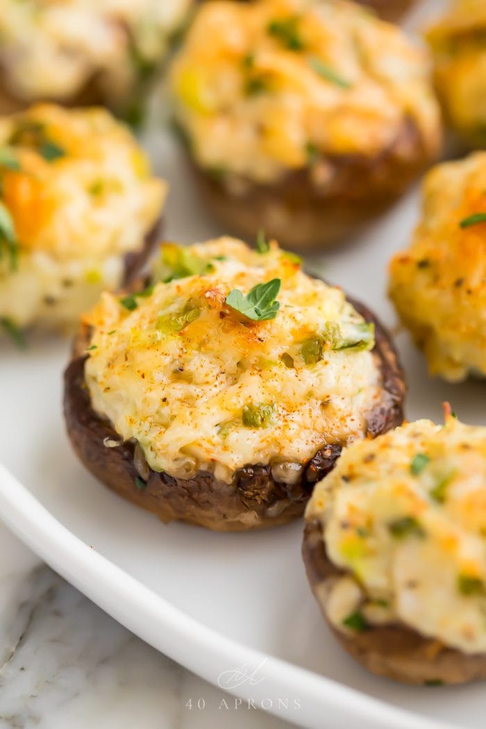 Stuffed mushrooms on a white plate ready to serve