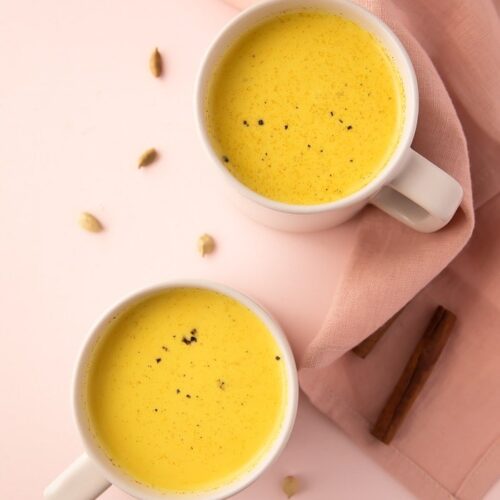 Two mugs of golden milk