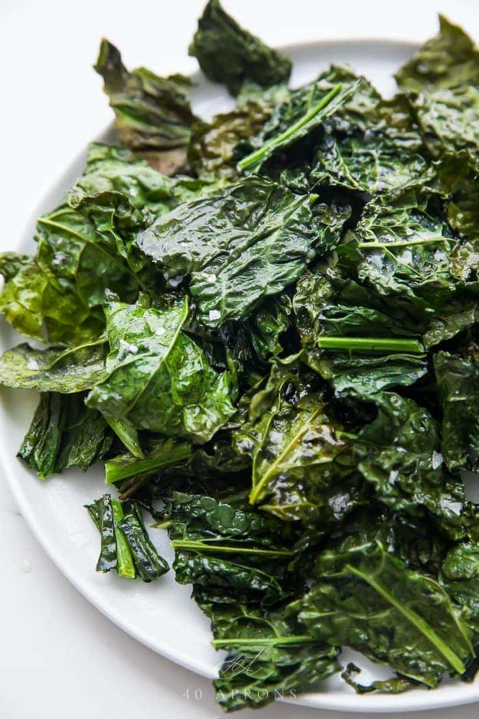 A pile of crispy kale chips on a plate