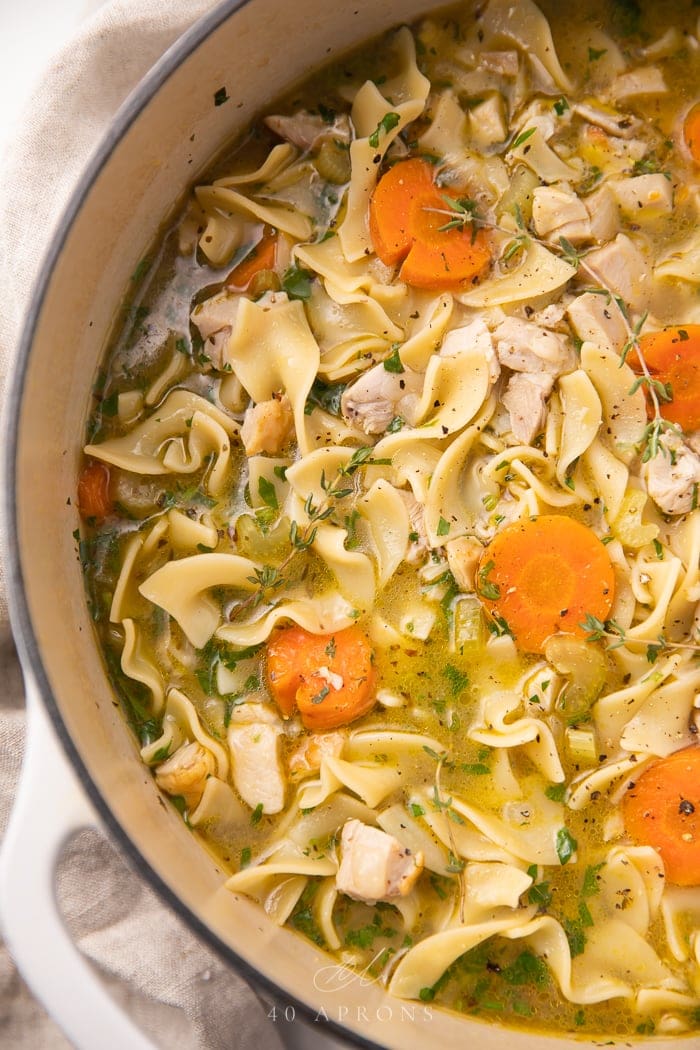 Leftover turkey soup in a pot.