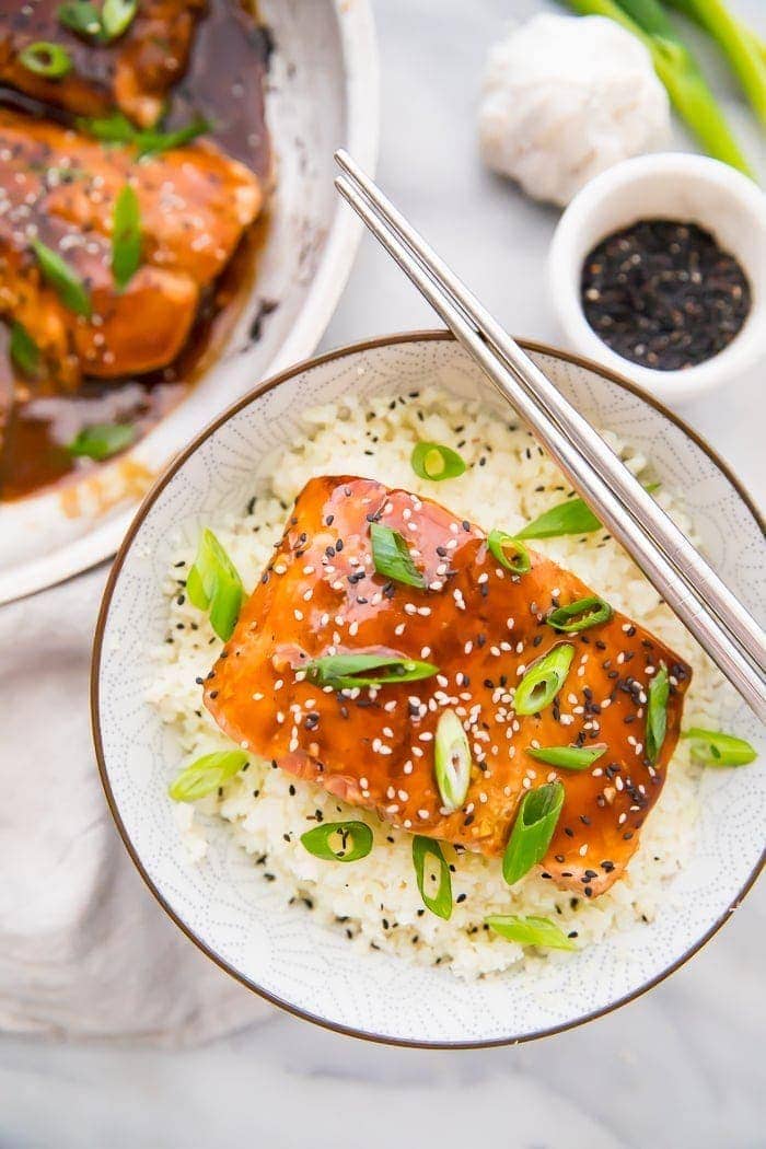 Teriyaki served in a bowl with cauliflower rice and chopsticks