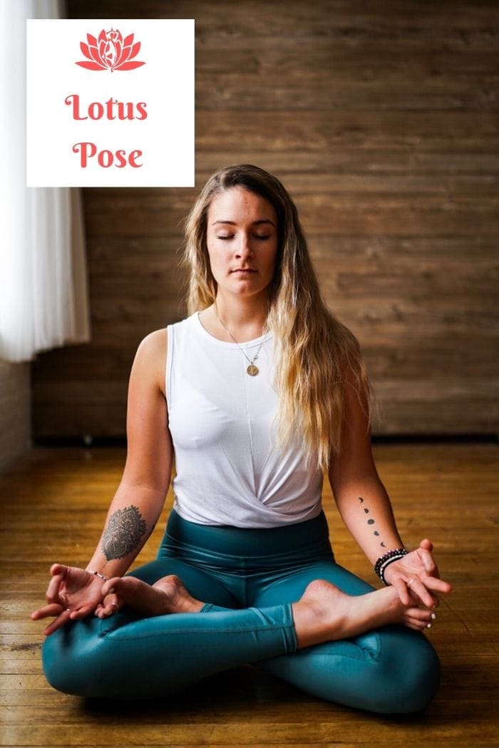 a blonde long-haired woman sitting on the floor in the lotus position