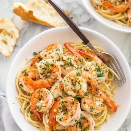 Shrimp with pasta served in a bowl with a fork