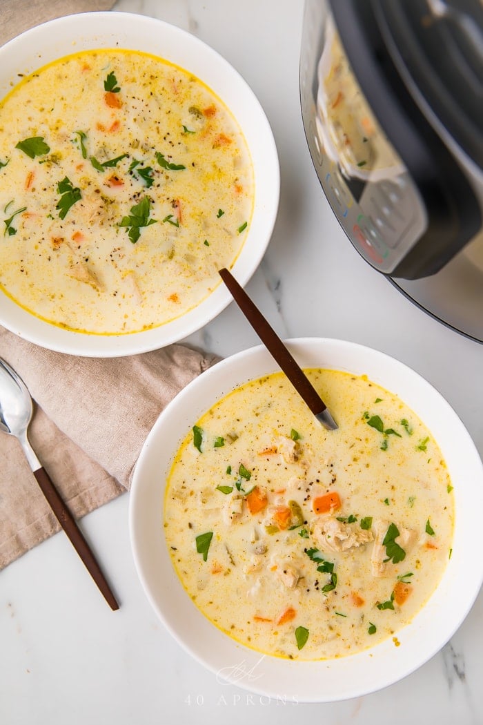 whole30 chicken and rice soup served in two white bowls