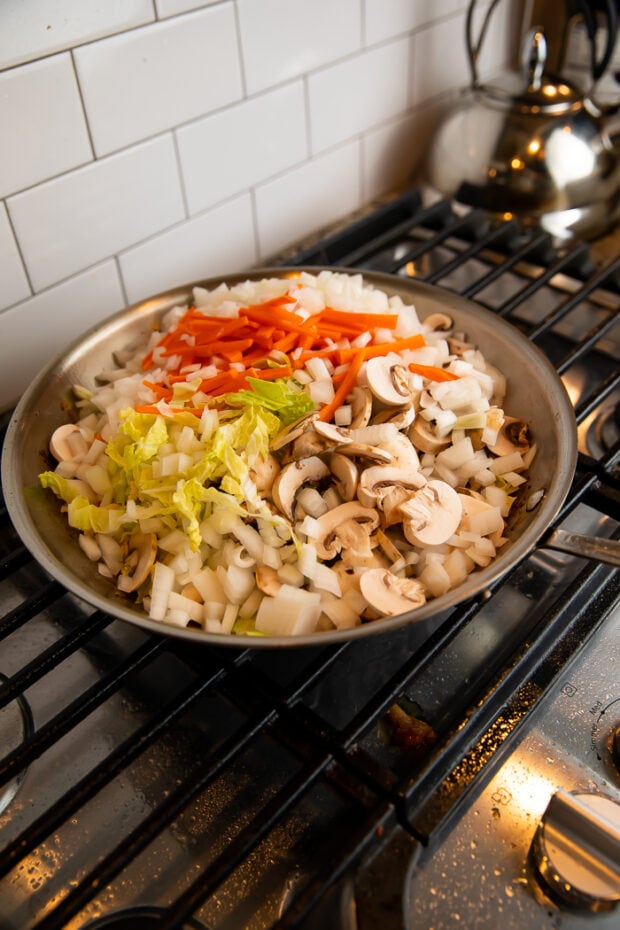 Veggies added to wok