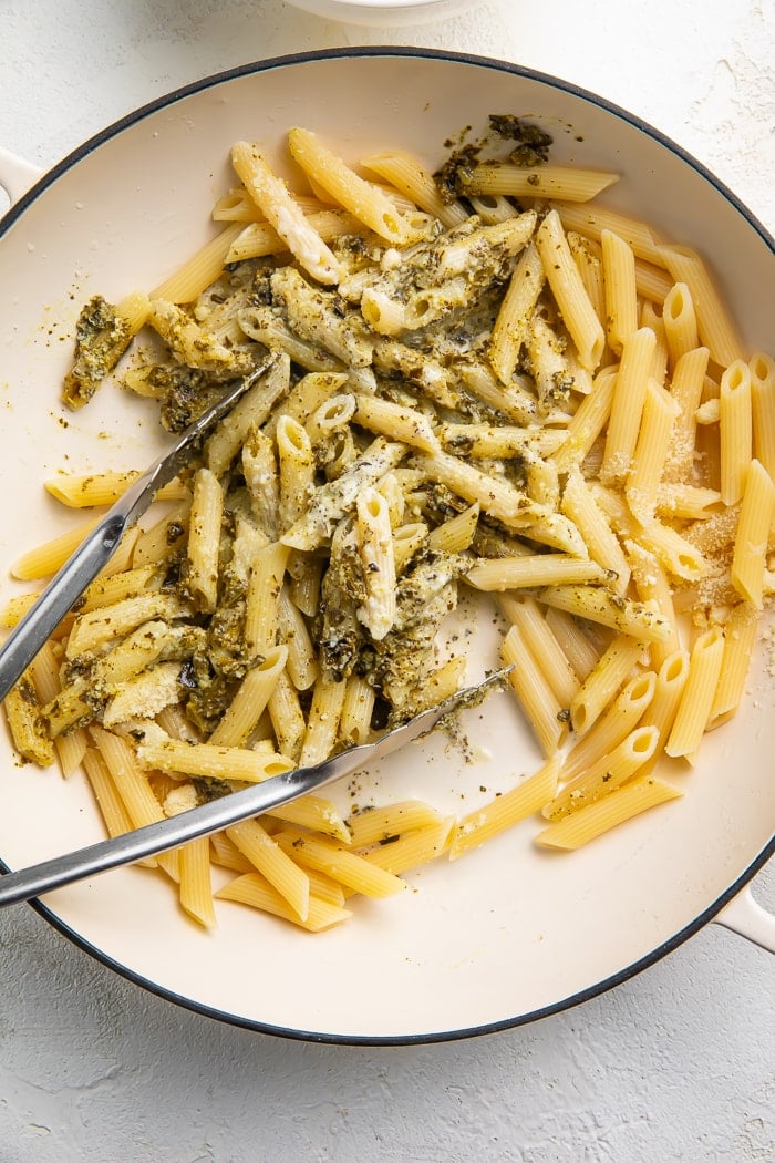 Chicken pesto pasta being stirred