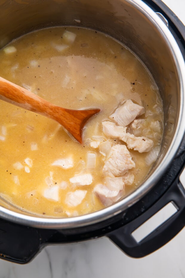 Add in chicken broth and liquid ingredients to Instant Pot