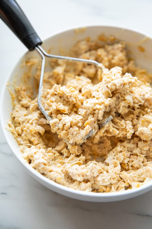 Mashed chickpeas in a large bowl