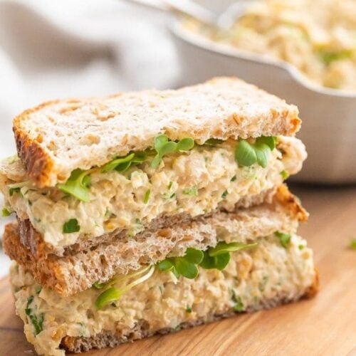 Chickpea salad sandwich on a wooden board