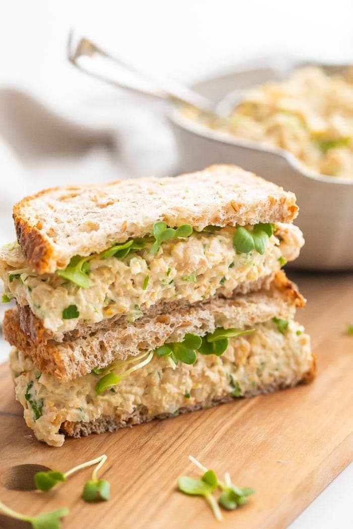 Chickpea salad sandwich on a wooden board