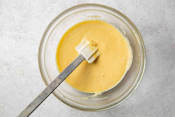 Thinner batter for paleo pancakes in a glass mixing bowl.