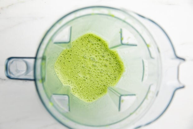 Blended iced matcha latte in a blender