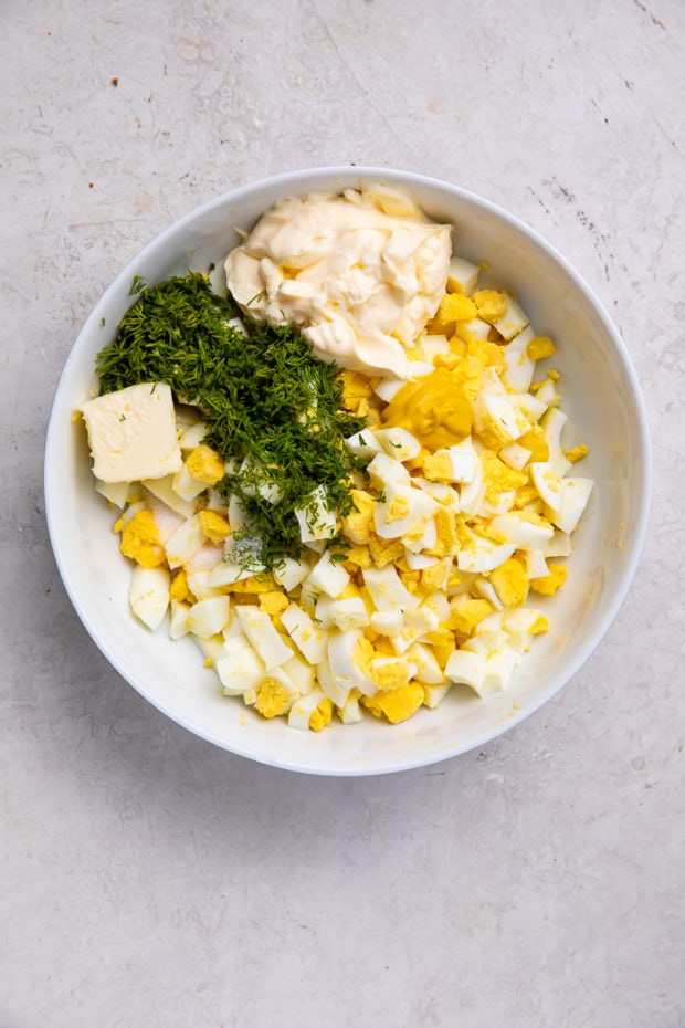 Ingredients for egg salad in a bowl