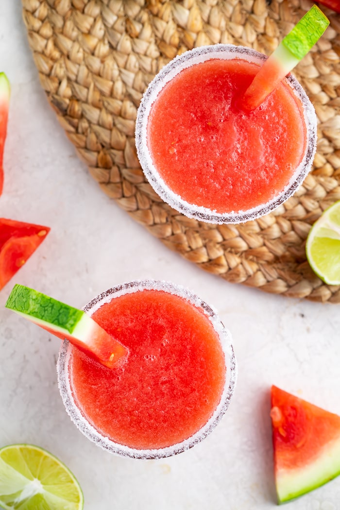 Overhead of two glasses of watermelon margaritas