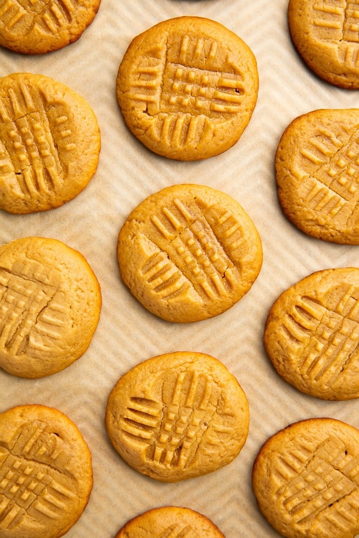 Keto peanut butter cookies on a cookie sheet lined with parchment paper