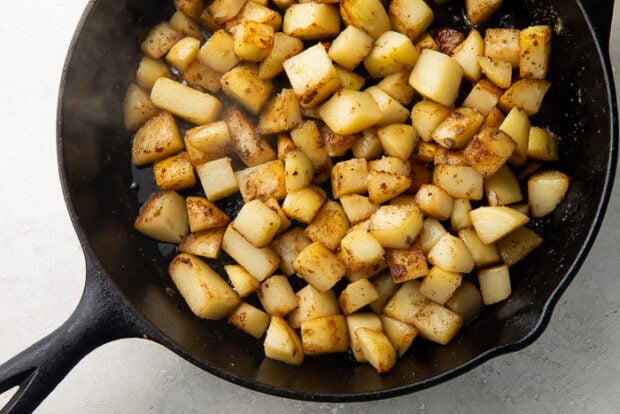 Gluten free roasted red potatoes in a cast iron skillet