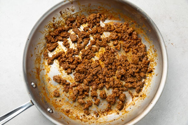 Ground beef being cooked in a skillet