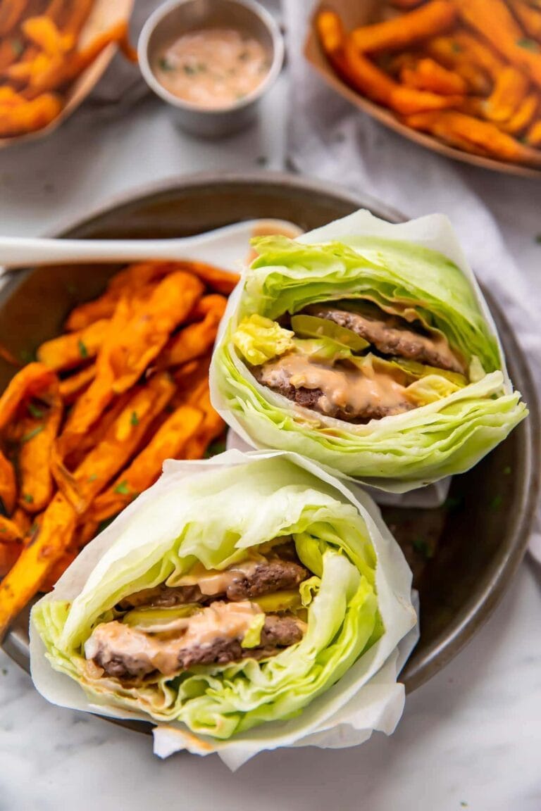 Two lettuce wrapped big macs with sweet potato fries