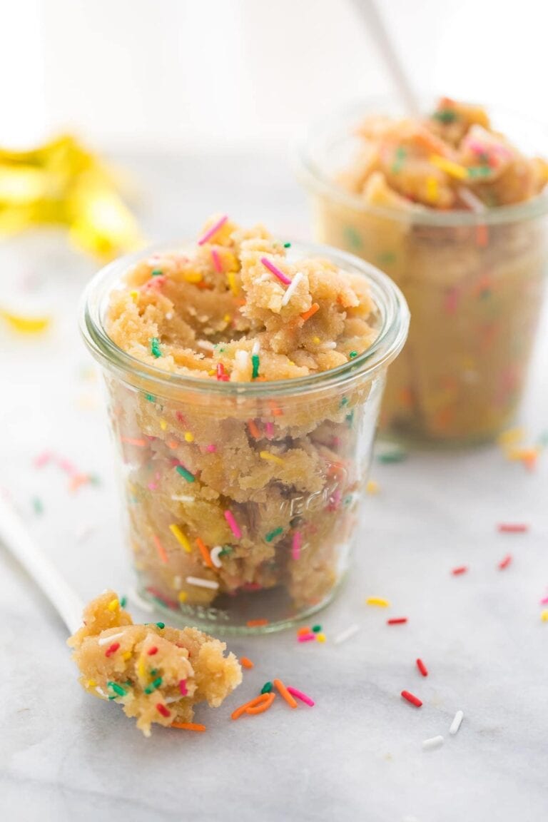 Birthday cake cookie dough in a glass cup