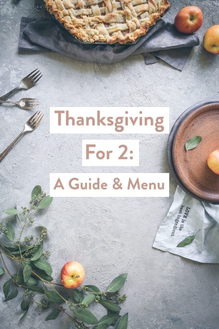 A tablescape with Thanksgiving foods with the text Thanksgiving For 2: A Guide & Menu