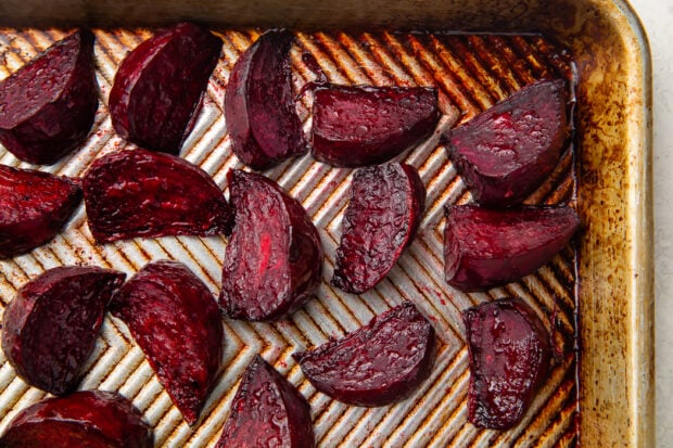 Roasted beet wedges on silver sheet pan