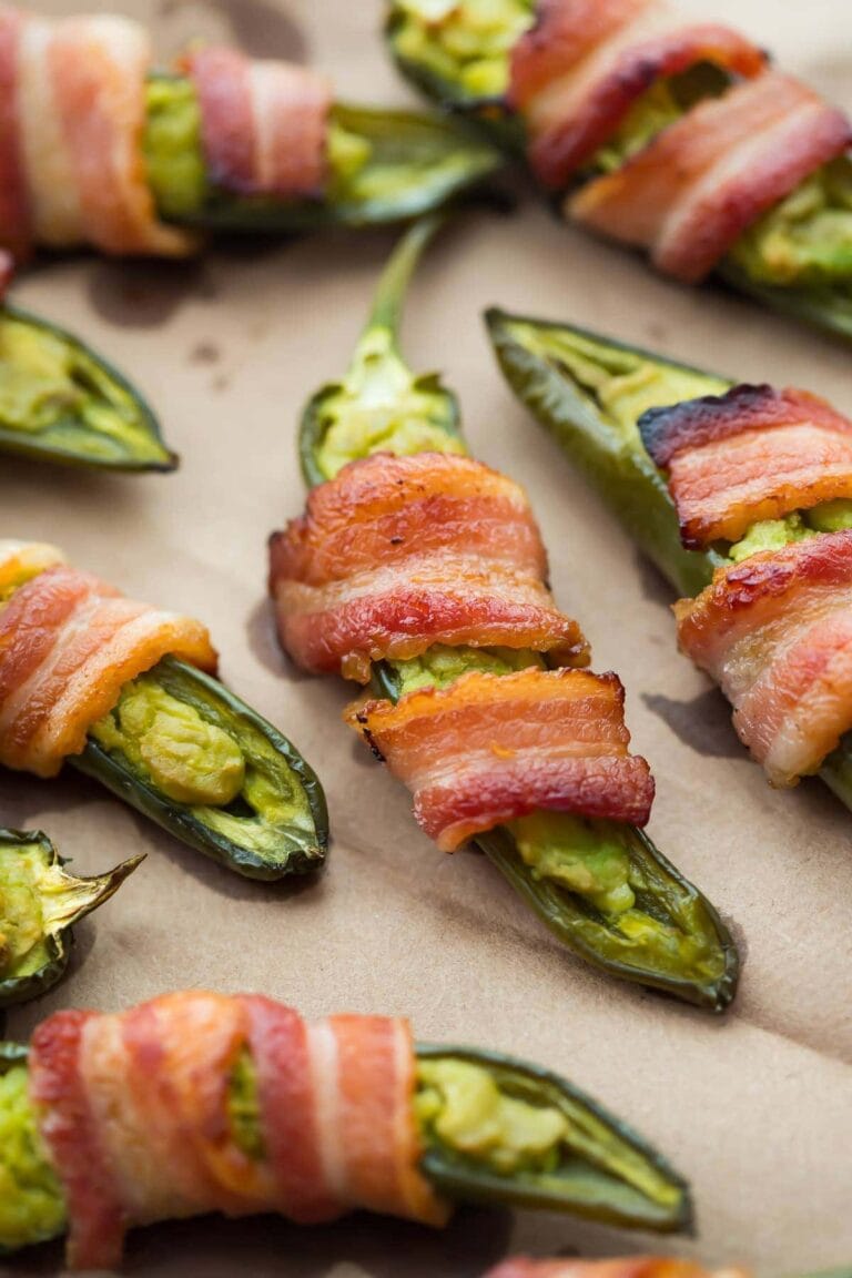 Close view of jalapeno poppers wrapped in bacon.