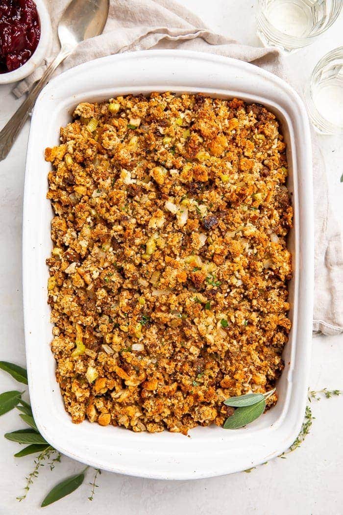 Overhead photo of a white casserole dish with Thanksgiving sausage stuffing