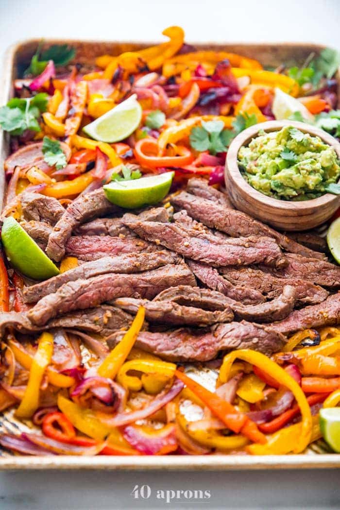 Fajita peppers and steak on a sheet pan